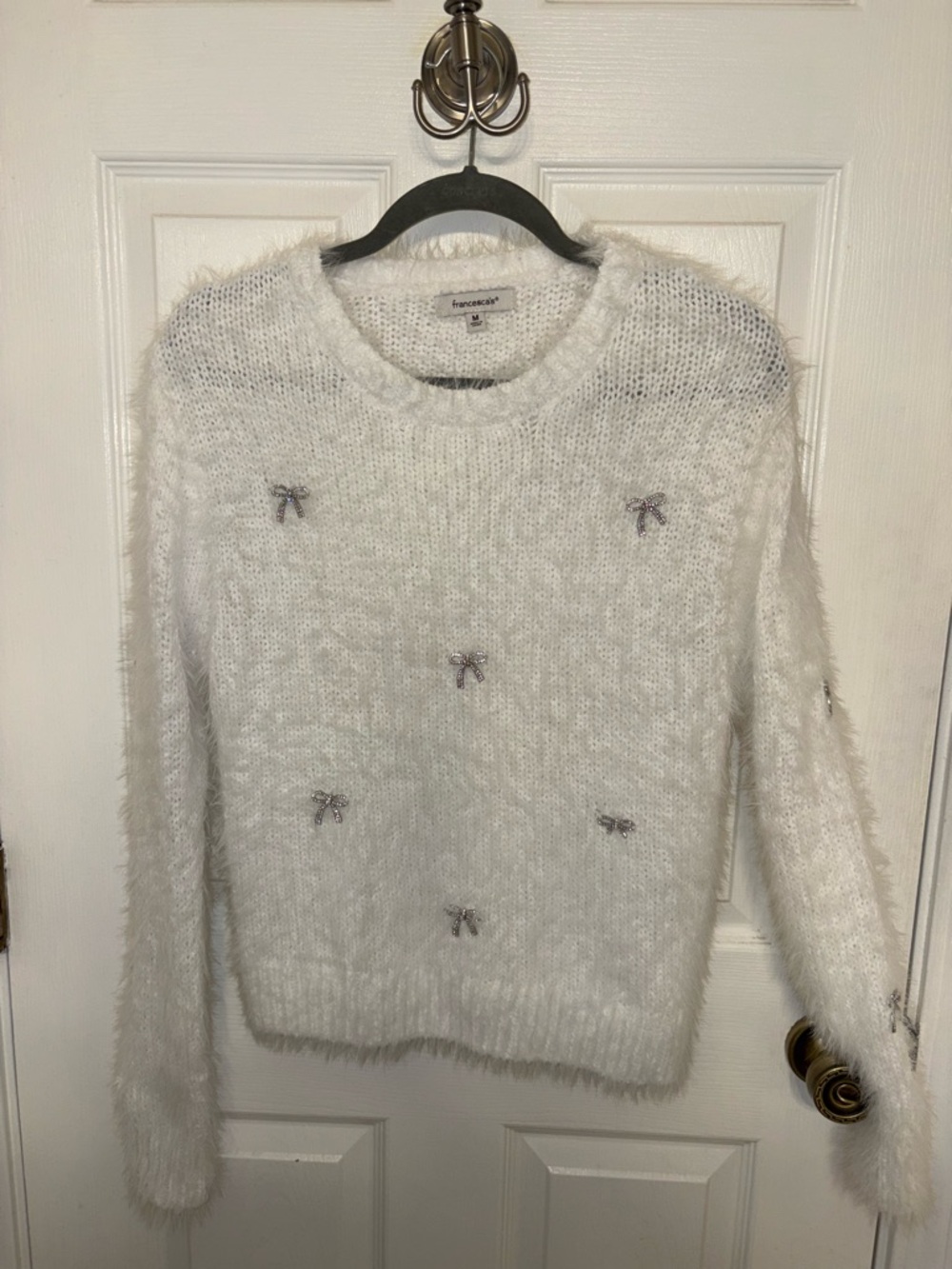 Francesca's Collections White Fuzzy Bow-Accent Crewneck Sweater